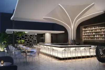 a restaurant with chairs and a bar with wine bottles at AC Hotel By Marriott Miami Brickell in Miami