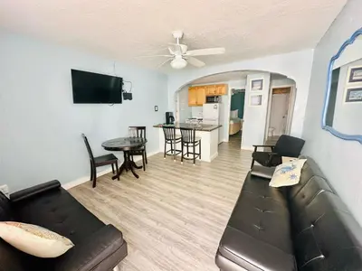 a living room with a couch and a table at St Maurice Beach Inn in Hollywood