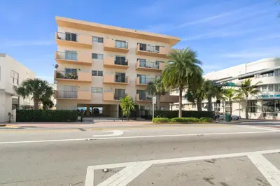 an empty street in front of a building at 2 Bedroom 2 Bath With Patio On 11th Collins ave in Miami Beach