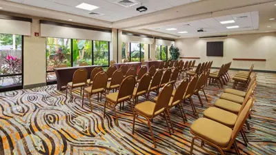 a conference room with chairs and a podium in it at Best Western Plus Kendall Hotel & Suites in Kendall