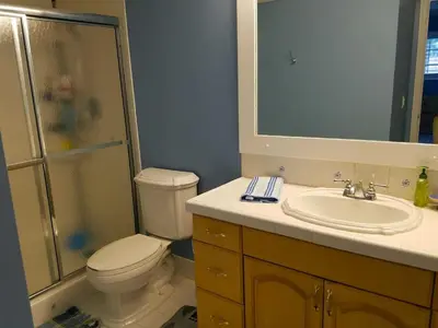 a bathroom with a toilet and a sink and a shower at Large Lush Oasis Paradise by FLL Beach and Galleria - 2bd 2ba in Fort Lauderdale