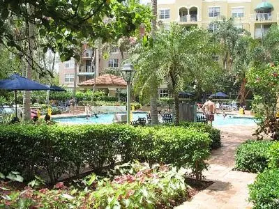 a resort with a swimming pool and a building at Resort Style In Aventura Florida in Aventura