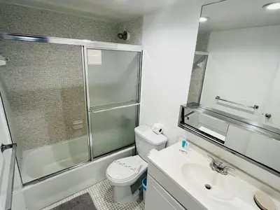 a bathroom with a shower and a toilet and a sink at Miami Hollywood Great 2 Bedroom 2 Bathroom with Intercostal View 001-22bvic in Hollywood