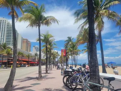 a group of bikes parked on a sidewalk next to the beach at Apts with Backyard Near Fort Lauderdale Beach, Nightlife, Cruise Port, Airport in Fort Lauderdale