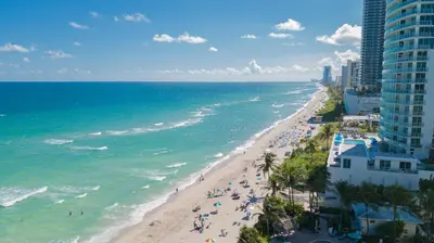 an aerial view of a beach and the ocean at The Tides Apartments on the beach in Hollywood