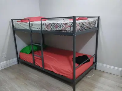 a couple of bunk beds in a room at Miami Cheapest Place in Miami