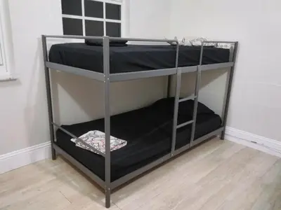 a bunk bed with black bunk beds in a room at Miami Cheapest Place in Miami