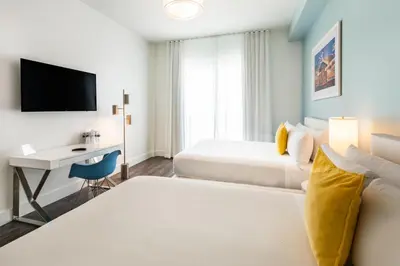 a hotel room with a bed and a desk at President Hotel in Miami Beach