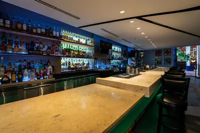 a bar with a lot of bottles of alcohol at Albion Hotel in Miami Beach