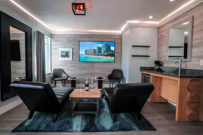 a dining room with a table and chairs at Colony Hotel in Miami Beach