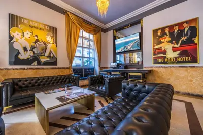 a living room with a couch and a table at Kent Hotel in Miami Beach
