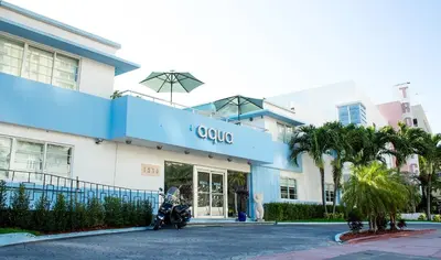 a motorcycle parked in front of a building at Aqua Hotel & Suites in Miami Beach