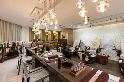 a salon with chairs and a long counter in a room at The Palms Hotel & Spa in Miami Beach