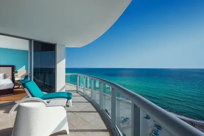 a resort balcony with a view of the ocean at Marenas Beach Resort in Miami Beach