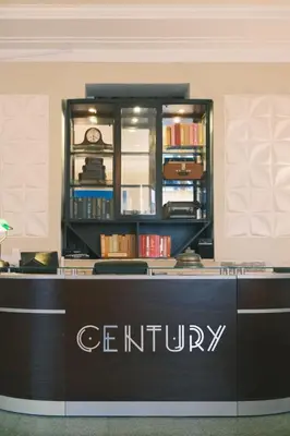 a sign for a scientology store with a shelf of books at Century Hotel in Miami Beach