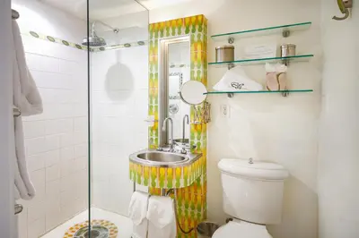 a bathroom with a sink and a shower at The Tony Hotel South Beach in Miami Beach