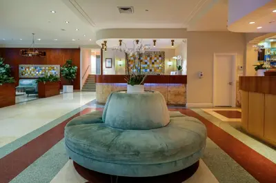 a lobby with a large ottoman in the middle at The Tony Hotel South Beach in Miami Beach