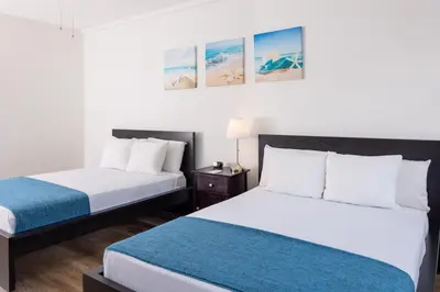 two beds in a hotel room with two beds at Lorraine Hotel in Miami Beach