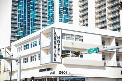 a white building with a large sign on it at Lorraine Hotel in Miami Beach
