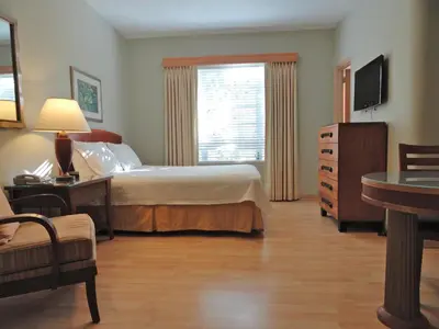 a hotel room with a bed and a window at Viscay Hotel in Miami Beach