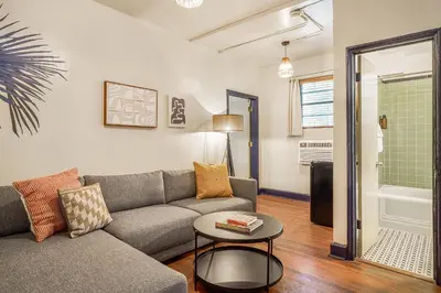 a living room with a couch and a table at Freehand Miami in Miami Beach