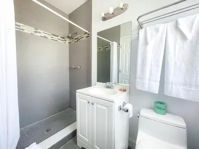 a bathroom with a sink and a toilet and a shower at Greniers in Hollywood