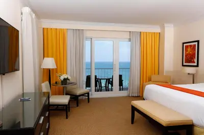 a hotel room with a bed and a view of the ocean at Sea View Hotel in Miami Beach