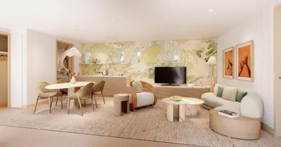 a living room with a couch and a table at Delano Miami Beach in Miami Beach
