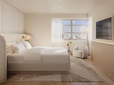 a white bedroom with a white bed and a window at Delano Miami Beach in Miami Beach