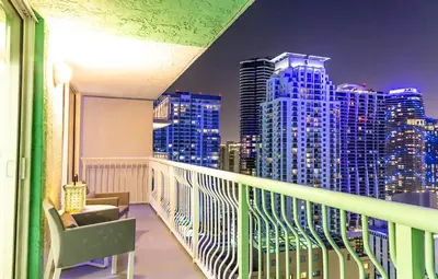a balcony with a view of a city at night at Top Stay Miami Blue Brickell in Miami