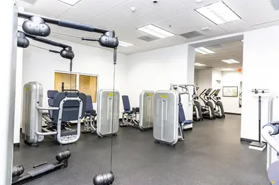 a gym with rows of chairs and machines at Top Stay Miami Blue Brickell in Miami