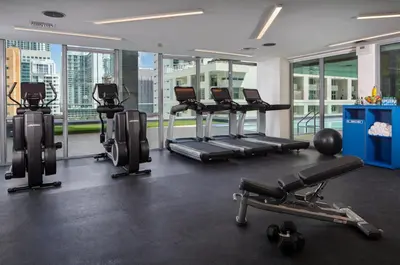 a gym with treadmills and exercise equipment in a building at Hotel Indigo Miami Brickell by IHG in Miami