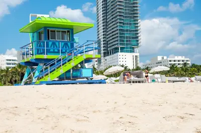 a lifeguard house on the beach with a slide at Greenview Hotel By Lowkl in Miami Beach
