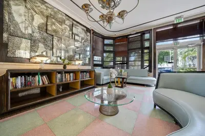 a living room with a couch and a table at Greenview Hotel By Lowkl in Miami Beach