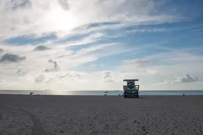 a life guard stand on a beach with the ocean at Ocean Beach Suites in Miami Beach
