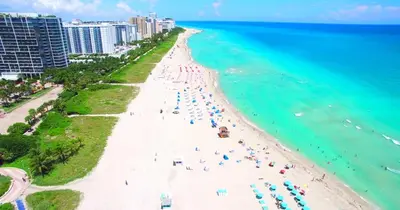 an aerial view of a beach with people on it at Ocean Beach Suites in Miami Beach