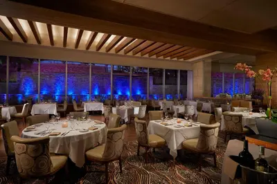a banquet room with tables and chairs and blue lights at Seminole Hard Rock Hotel & Casino Hollywood in Fort Lauderdale