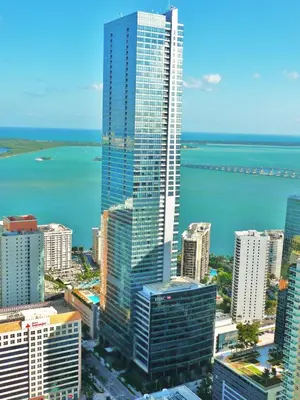 an aerial view of a city with buildings and the ocean at Private condo hotel at Four Seasons Brickell in Miami