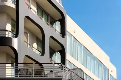 an external view of a building with balconies at Kimpton - Hotel Palomar South Beach by IHG in Miami Beach