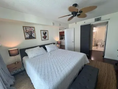 a bedroom with a bed and a ceiling fan at Fabulous apartment in Brickell in Miami