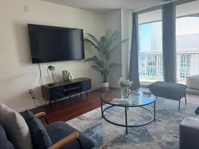 a living room with a flat screen tv on the wall at Fabulous apartment in Brickell in Miami