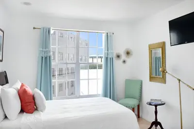 a bedroom with a bed and a large window at Beach Park Hotel in Miami Beach