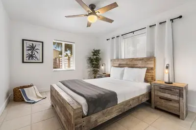 a bedroom with a bed and a ceiling fan at Alani Bay Premium Condos in Fort Lauderdale