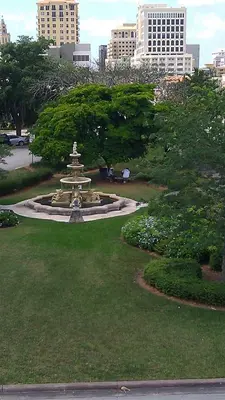 a fountain in the middle of a park in a city at Hotel Chateaubleau in Miami