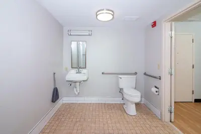 a bathroom with a toilet and a sink at Red Roof PLUS Miami Airport in Miami