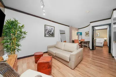 a living room with a couch and a table at Metropole Suites South Beach in Miami Beach