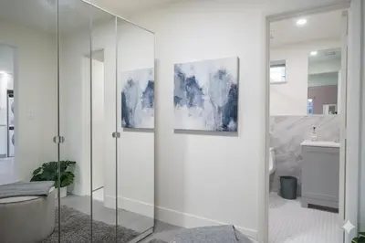 a bathroom with a glass shower stall and a toilet at Designer River View Apartments in Fort Lauderdale