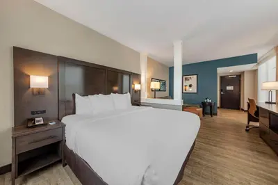 a large white bed in a hotel room at Comfort Inn & Suites Miami International Airport in Miami