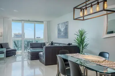 a living room with a couch and a table at OCEAN RESERVE 15th Floor - Gorgeous Ocean View - STR00907 in Miami Beach