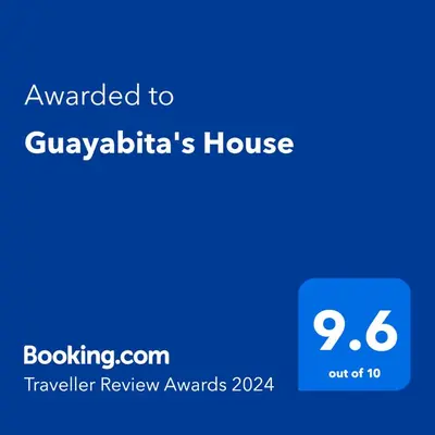 a screenshot of a phone with the text awarded to guvahatis house at Guayabita's House in Miami